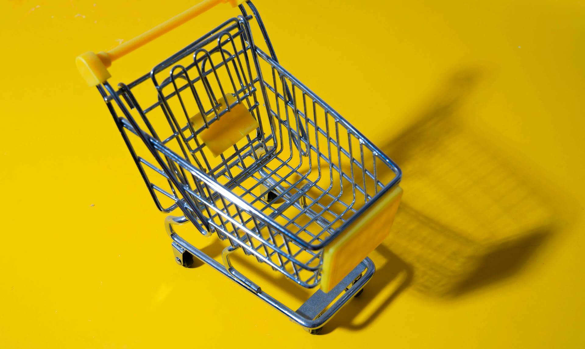 Yellow shopping cart symbolizing e-commerce sales and pricing